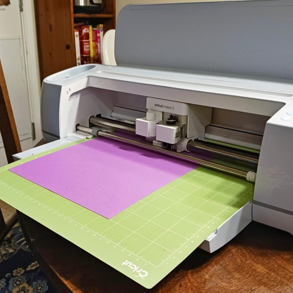 Cricut Maker 3 Machine being used to cut out 2024 pentomino puzzle pieces. 