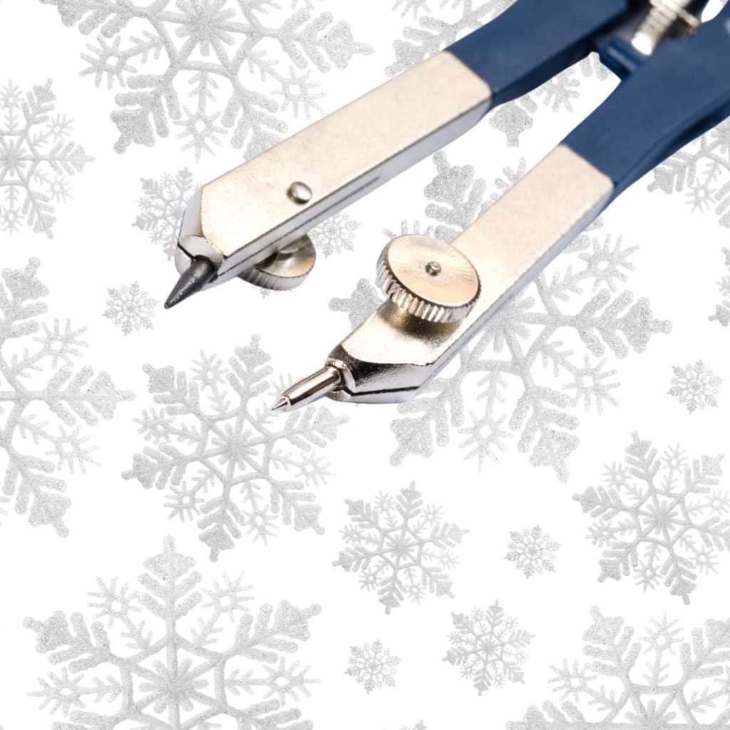 point of geometric compass on snowflake background. 