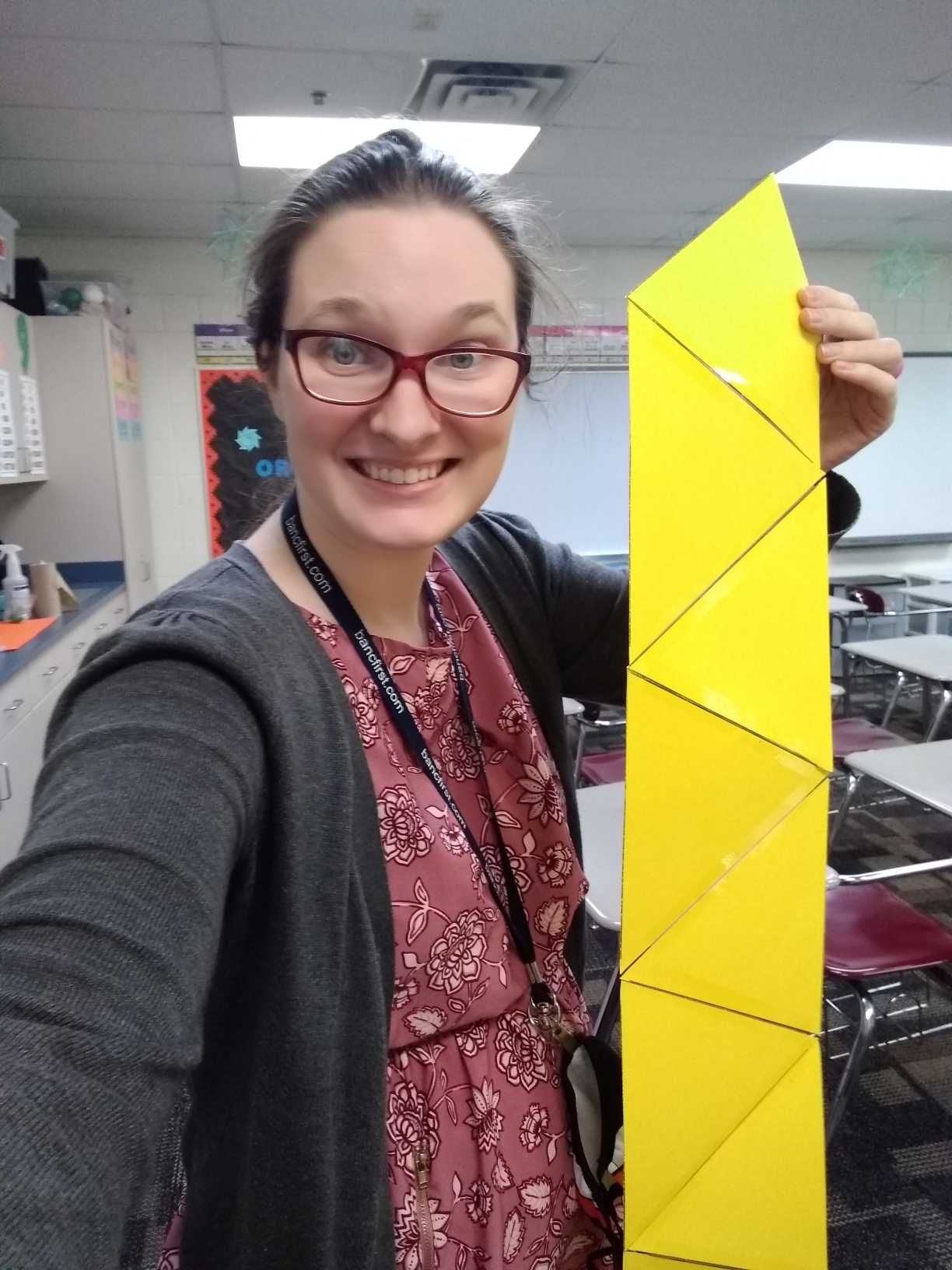 giant equilateral triangles taped together to form giant hexaflexagon. 