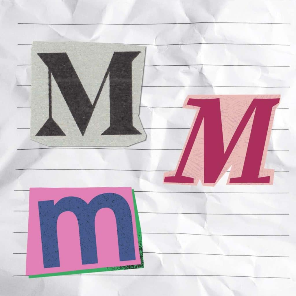 three letter M's that look like they have been cut out of a newspaper 