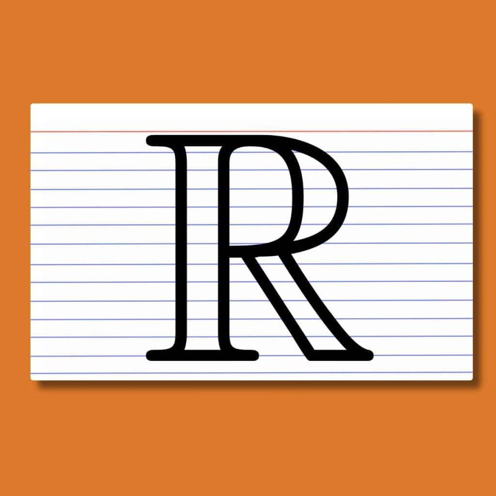 real number symbol on top of index card on orange background 